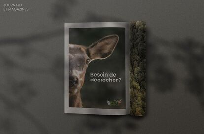 An advertisement for Parc Omega featuring a close-up of a young deer looking at the viewer. The text reads