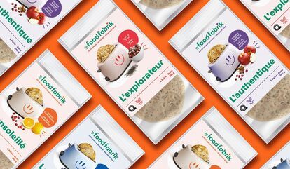 Several packages of Food Fabrik brand breads are set against an orange background. The packages are in different colors and bear the names “L'ensoleillé”, “L'explorateur” and “L'authentique”. Each package features an illustration of a smiling toaster, a l